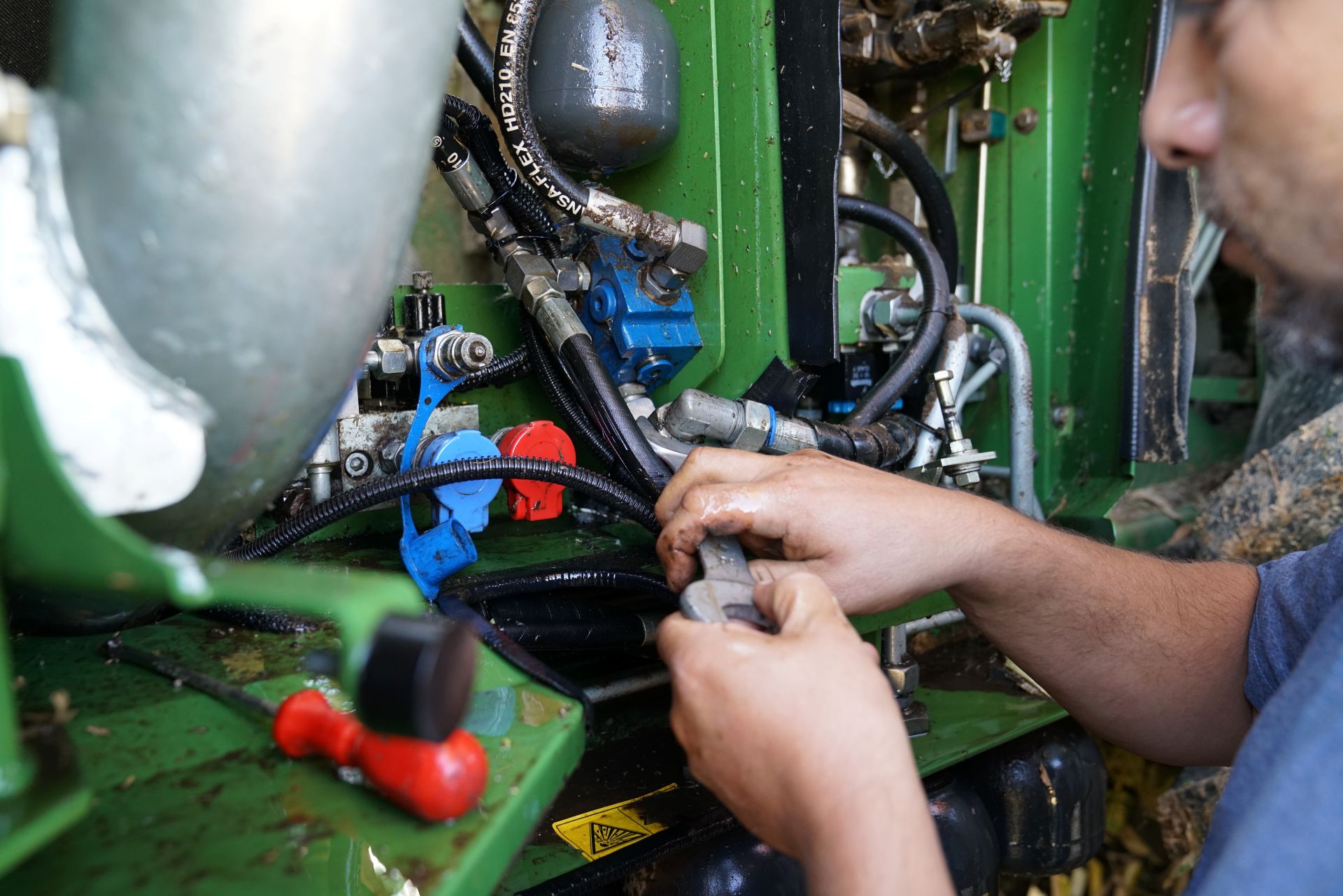 a tractor getting electrical work done