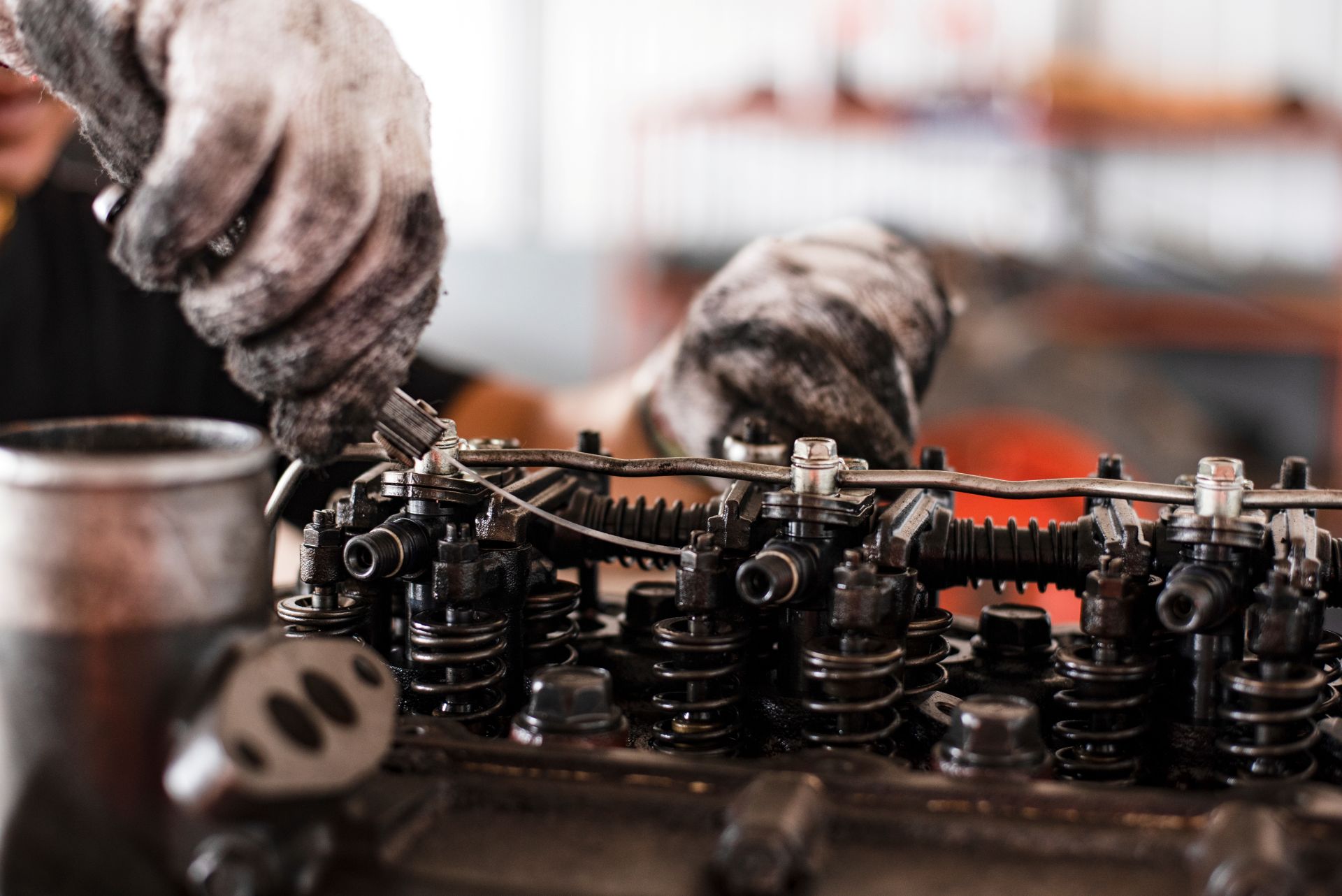 a tractor getting its valve tolerance inspected