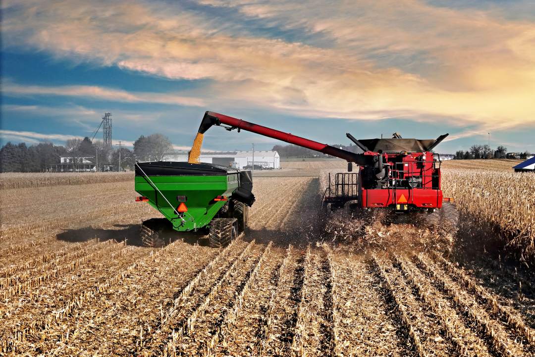 red combine and grain bin for sale