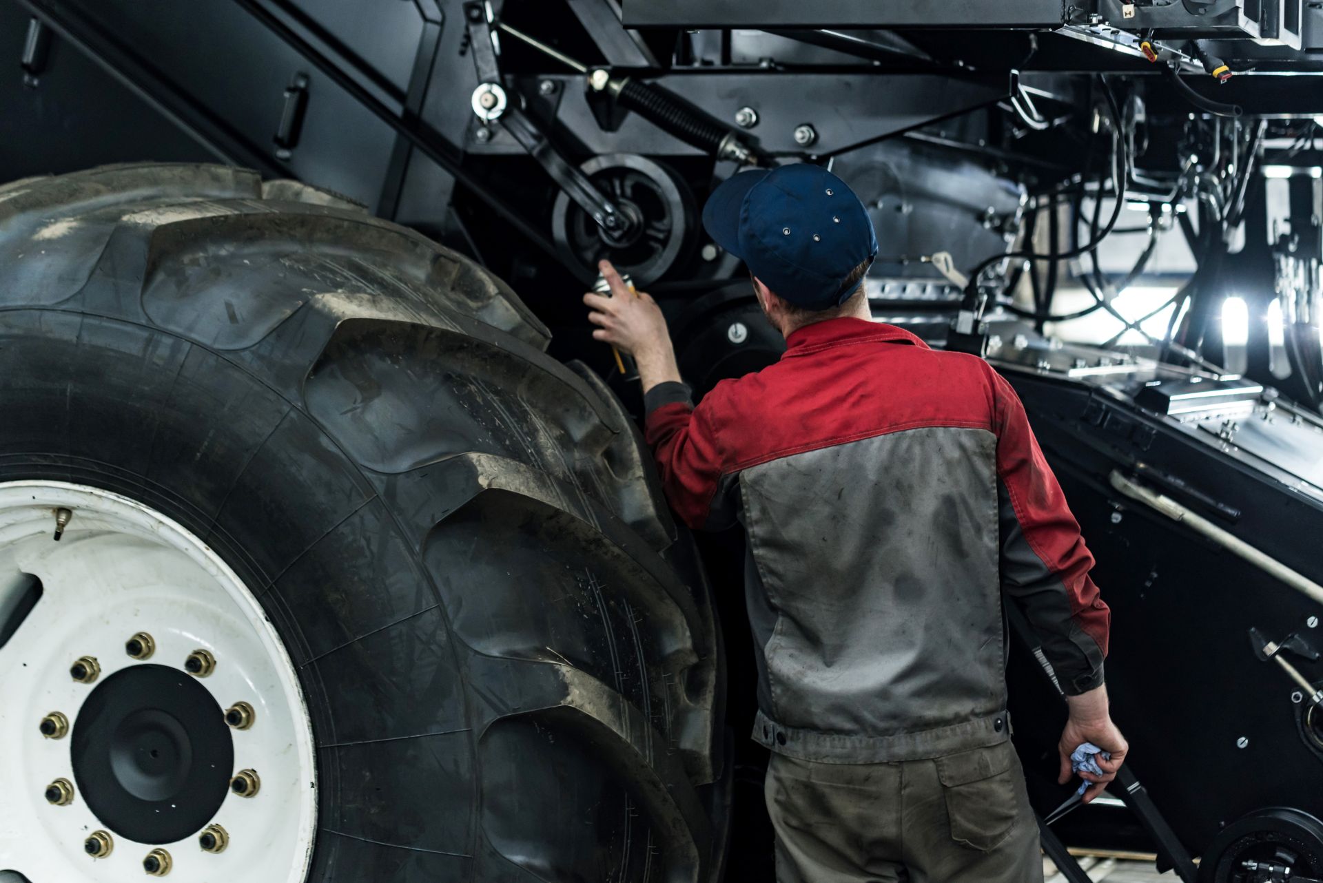 a mechanic working on a tractor