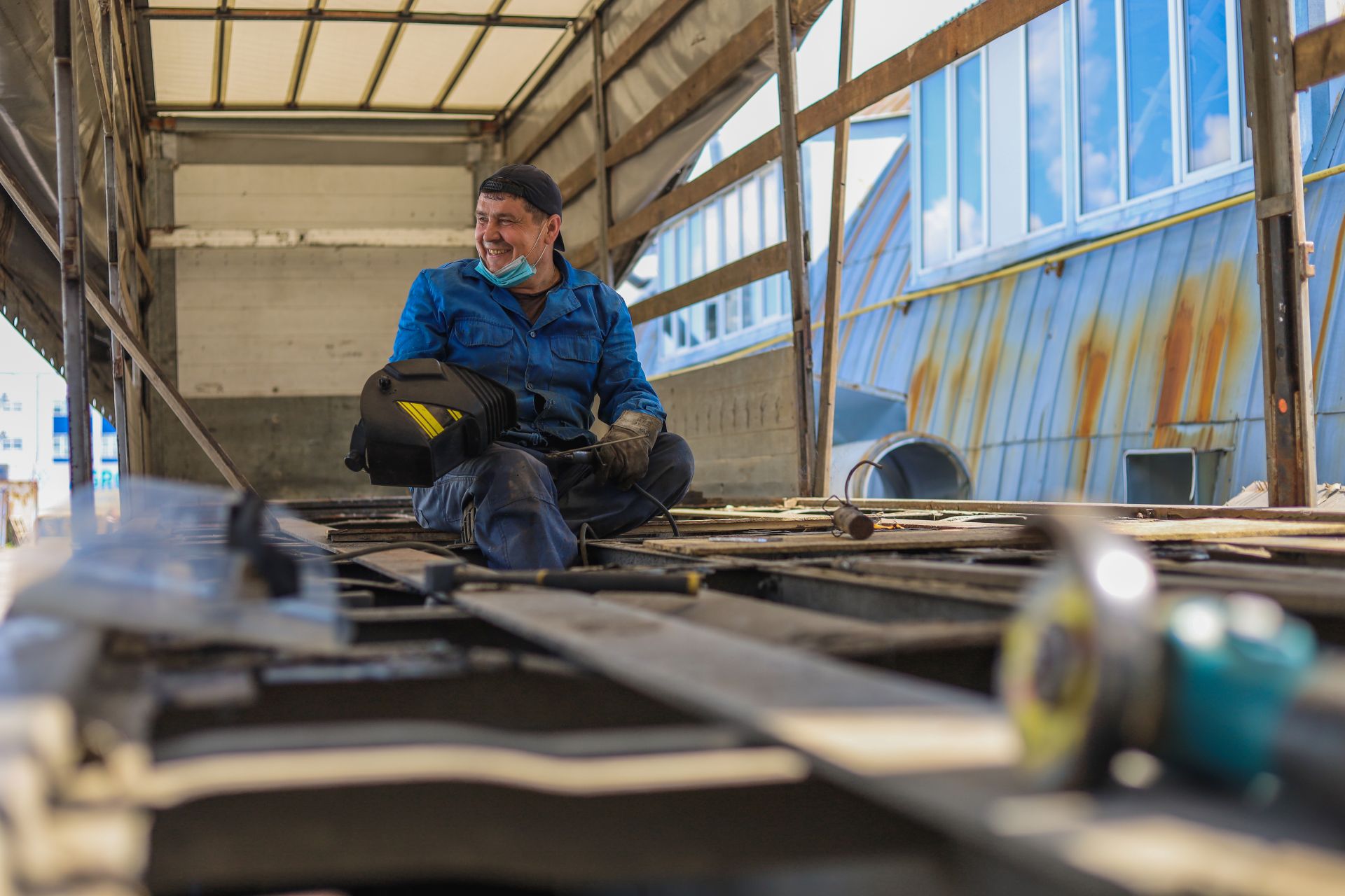 a welder at work in a trailer